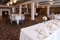 Banquet-room-with-white-place-settings