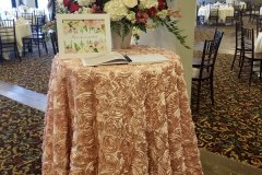 Blush-floral-table-cloth-with-guest-book-atop