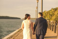 Bridge-and-groom-hold-hands-walking-away