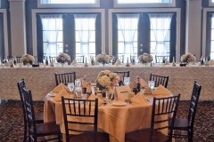 Wedding-table-place-setting-with-floral-bouquets-and-champagne