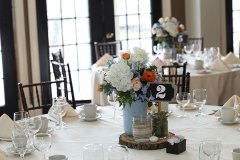 Wedding-table-with-flowers-in-a-mason-jar