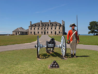 old fort niagara with solider and cannon afront